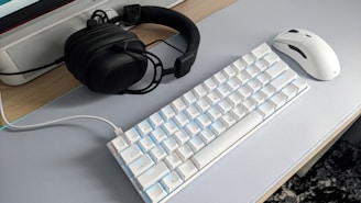 a keyboard and mouse on a desk