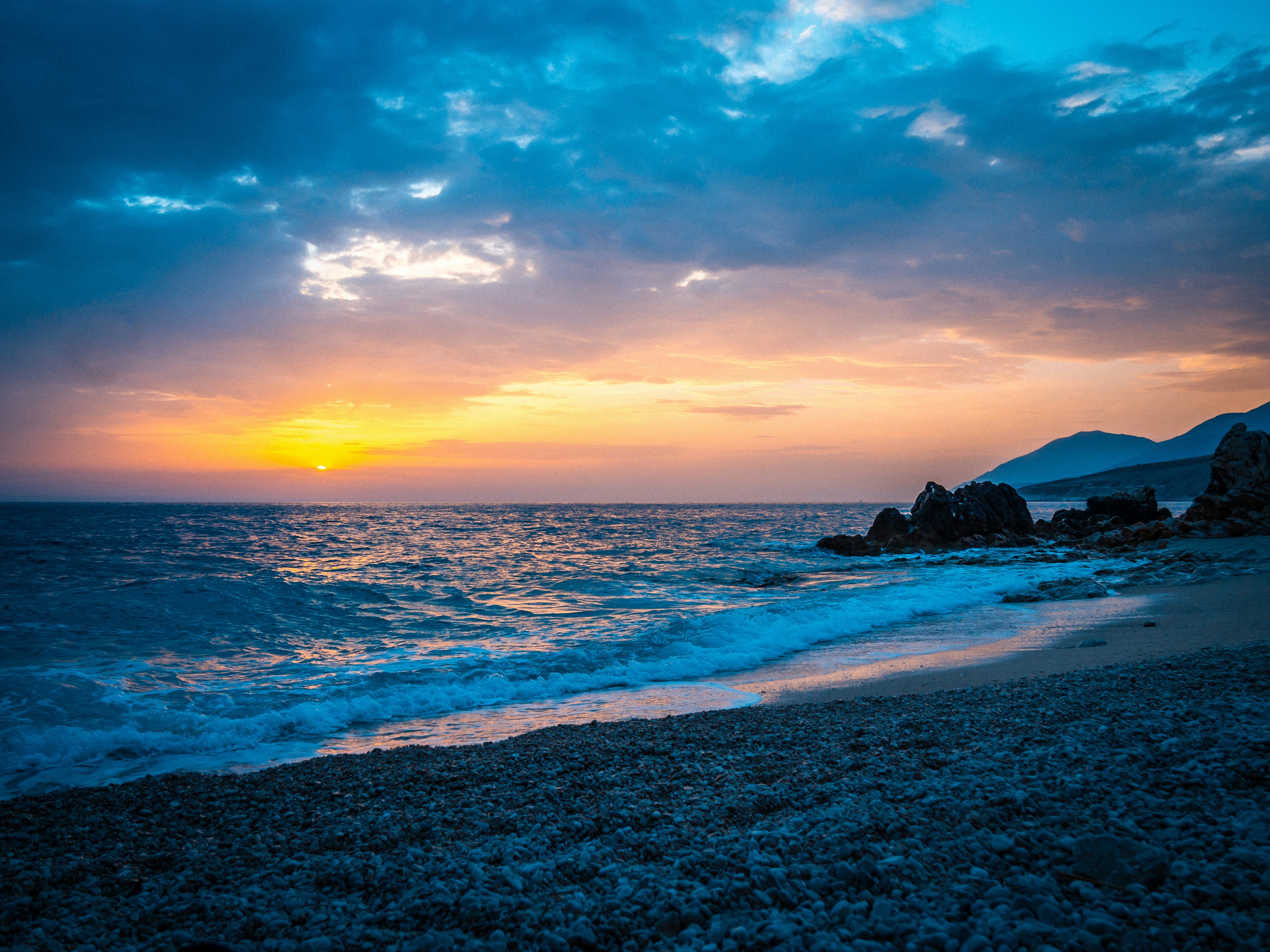 Scenic view of the beach and clear waters in Himarë, Albania