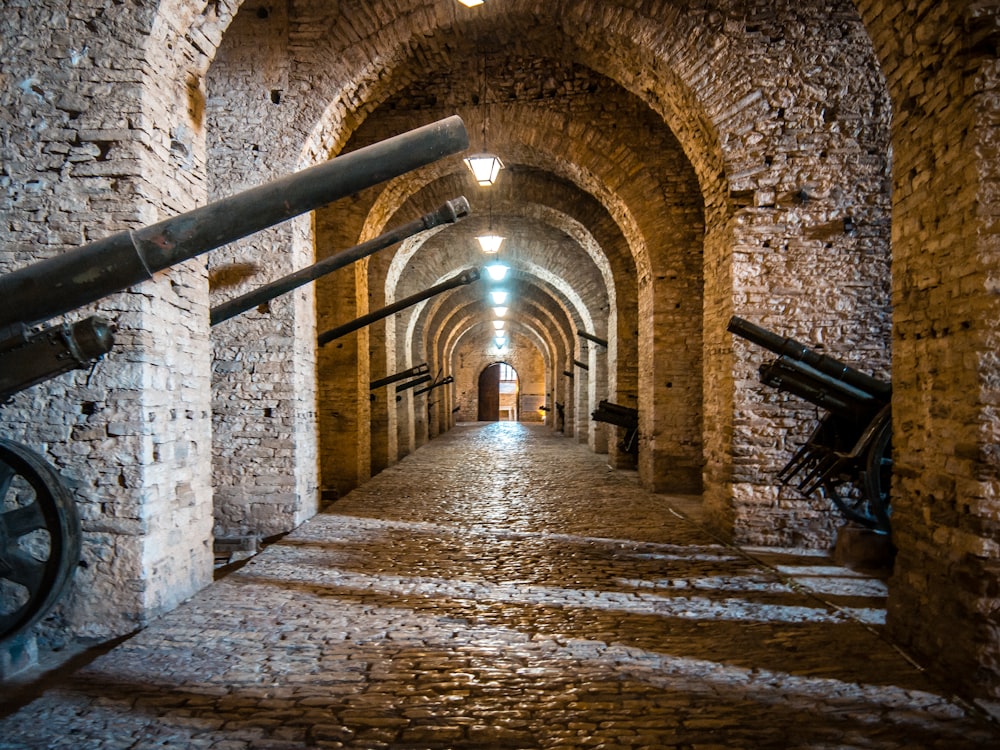 a stone tunnel with a staircase