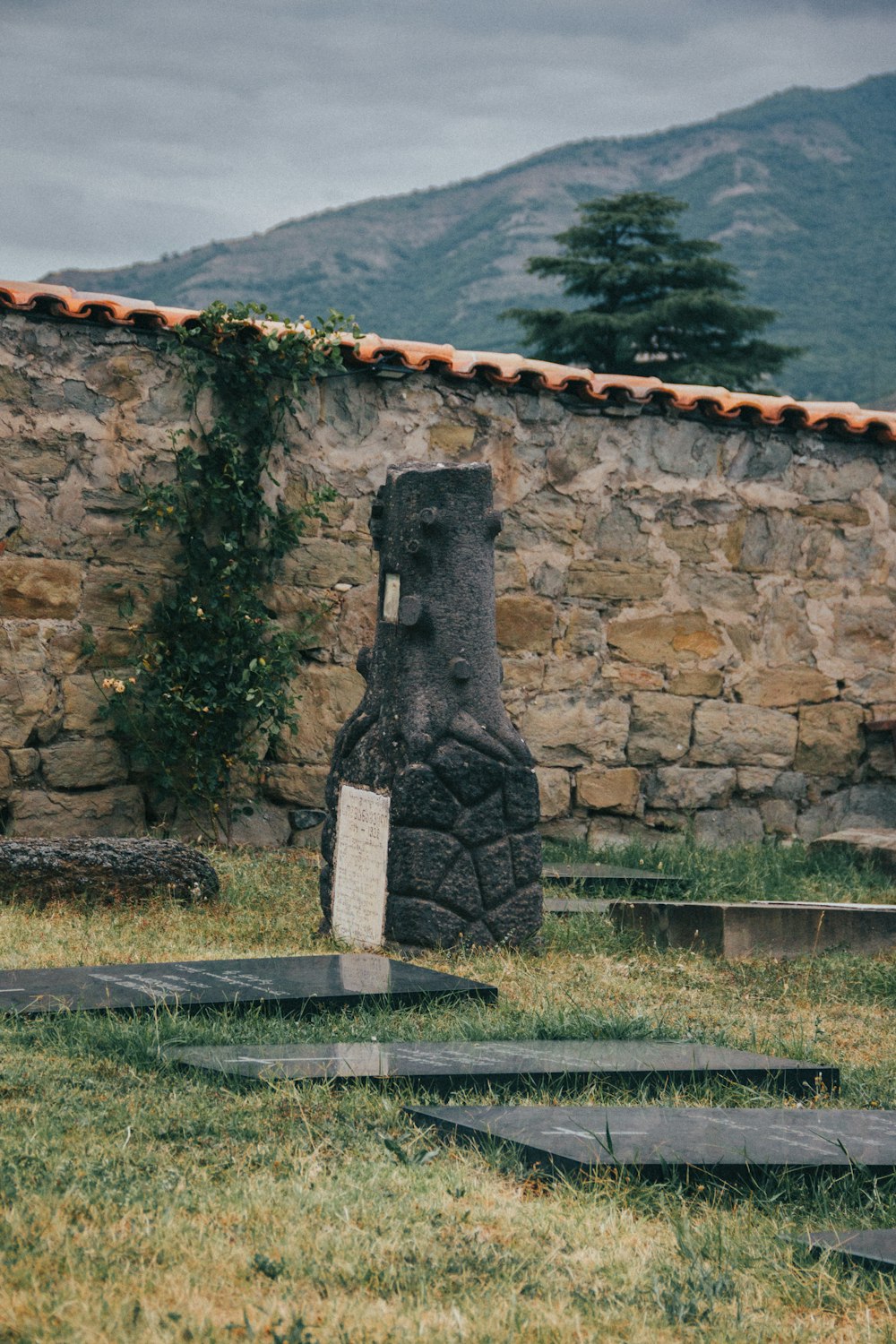 a stone wall with a stone arch