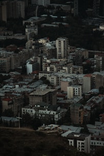 An aerial view of a bustling urban area with various residential buildings.