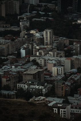 An aerial view of a bustling urban area with various residential buildings.
