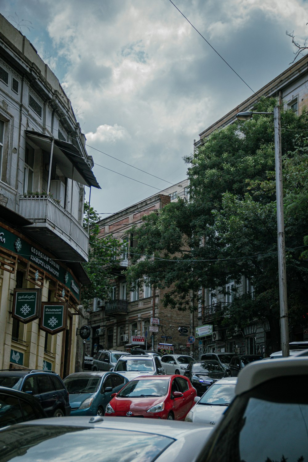 a street with cars and buildings on either side of it