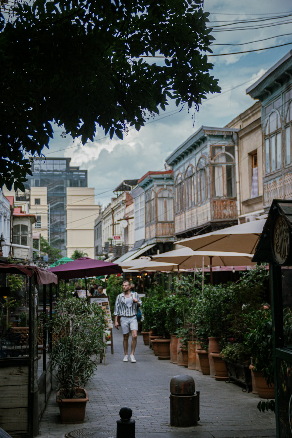 a person walking down a sidewalk