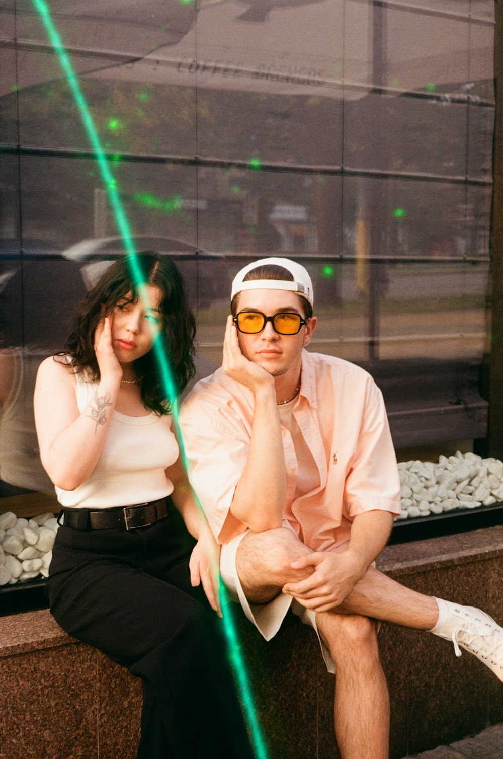 a man and woman sitting on a bench