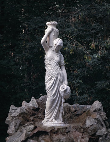 a statue of a person holding a baby