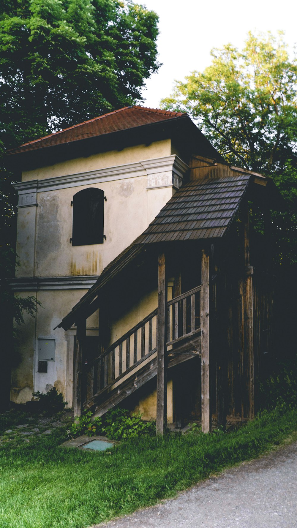 a wooden building with a fence around it