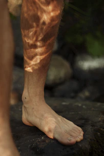 a person's leg with a hairy foot