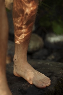 a person's leg with a hairy foot