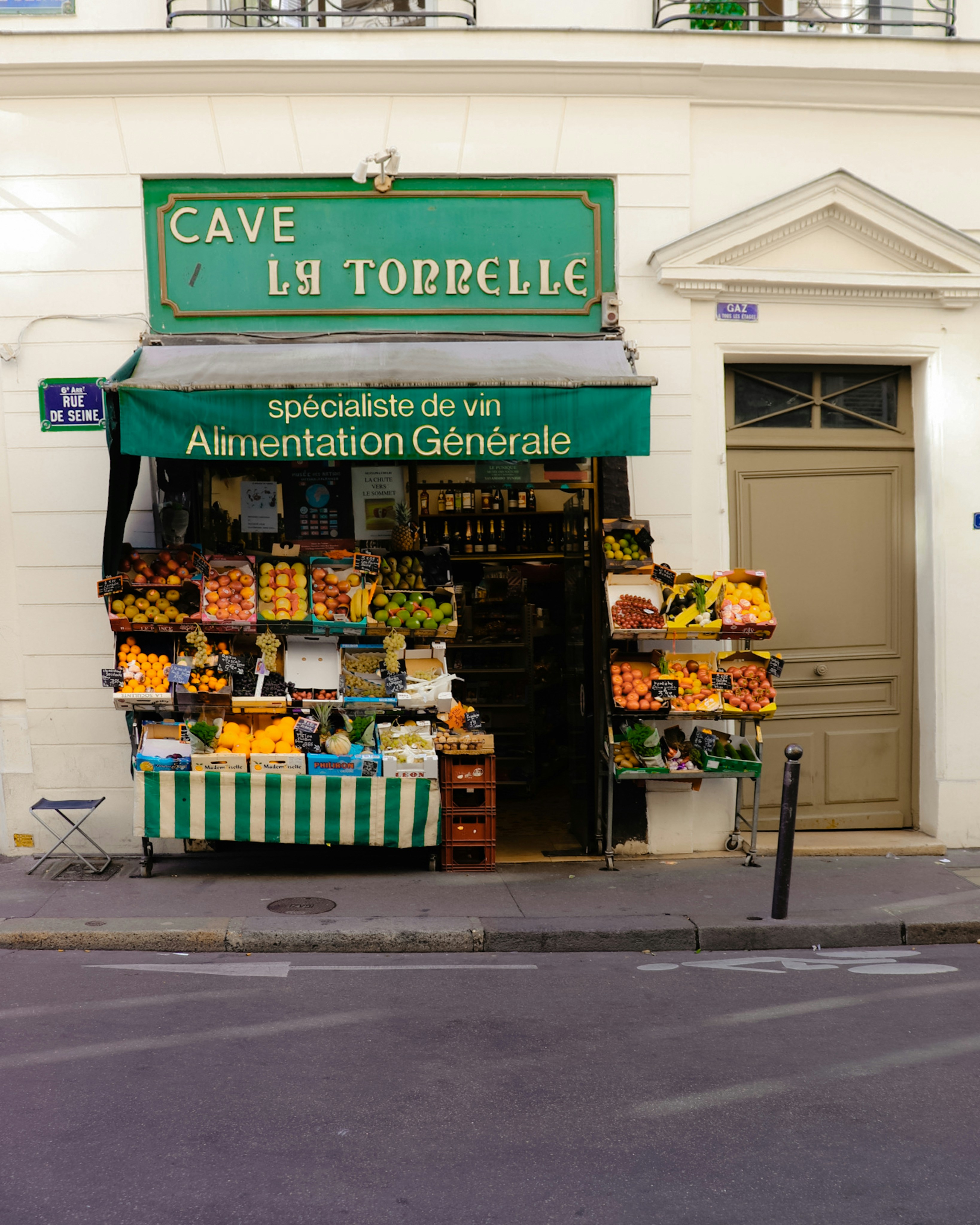 a store front with a green sign