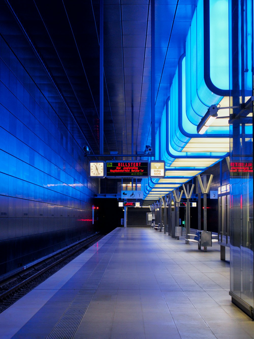 a train station with a sign