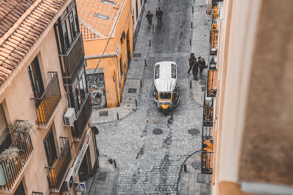 a street with cars and people