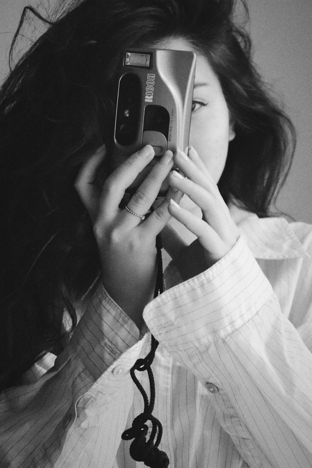 a woman holding a phone to her ear