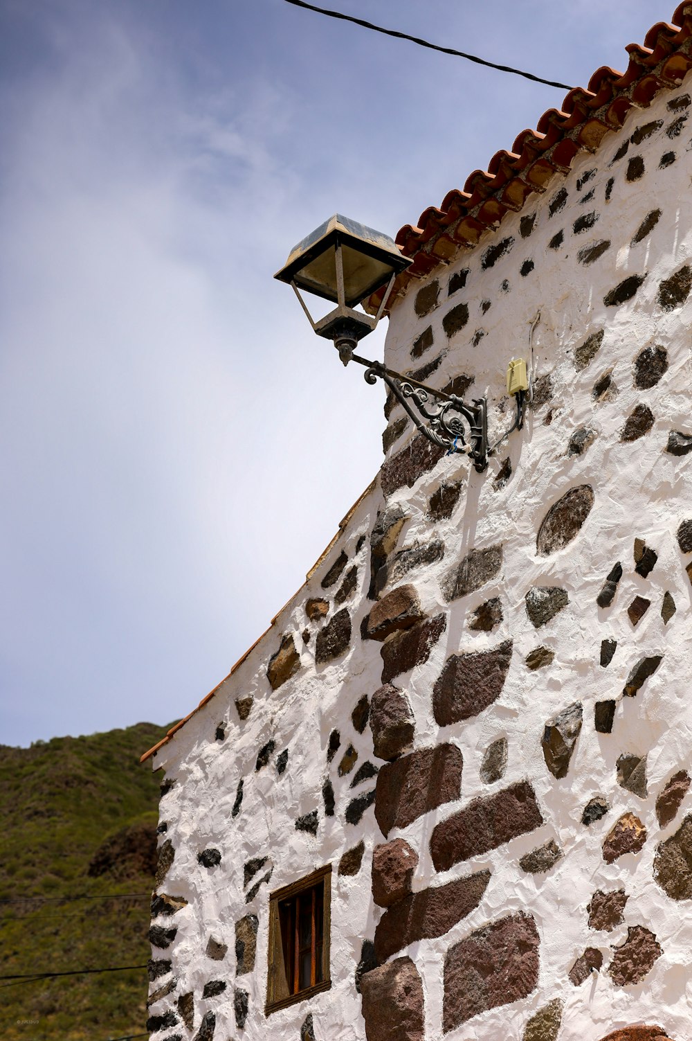 a brick building with a light on top