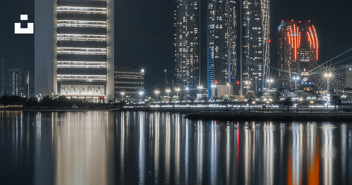 Splashed Buildings A couple of tall buildings by water photo – Free Grey Image on Unsplash