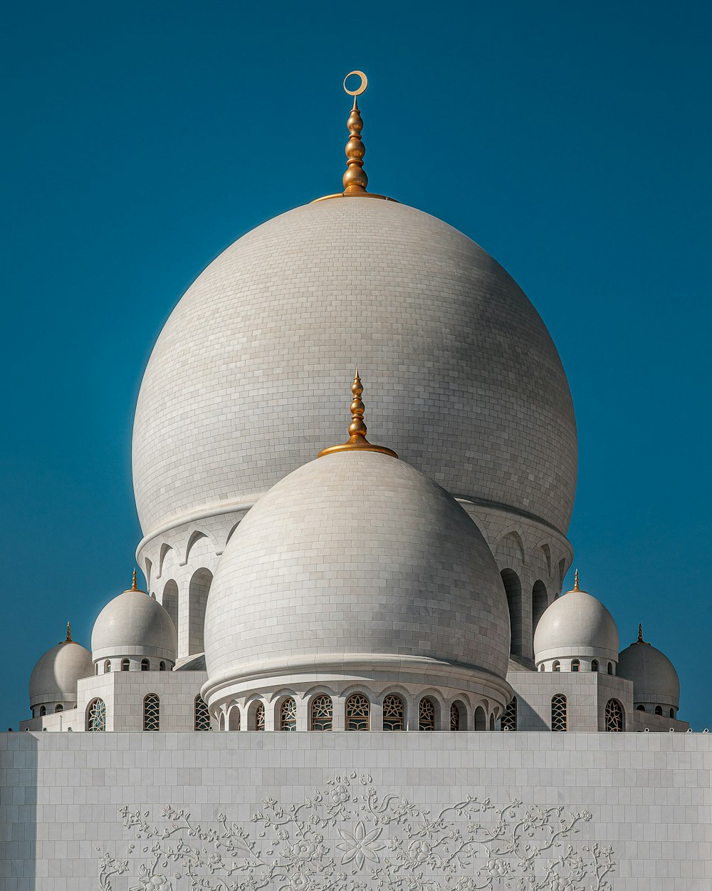 a large white building with domed roofs