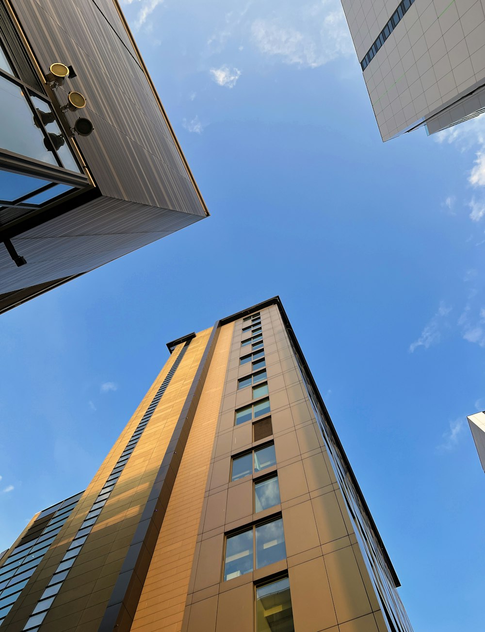 looking up at tall buildings