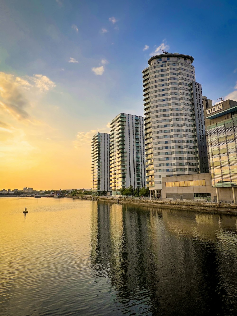 a body of water with buildings along it