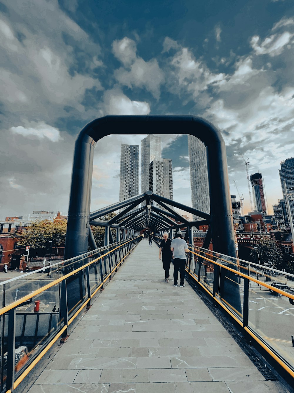 a bridge with people walking on it