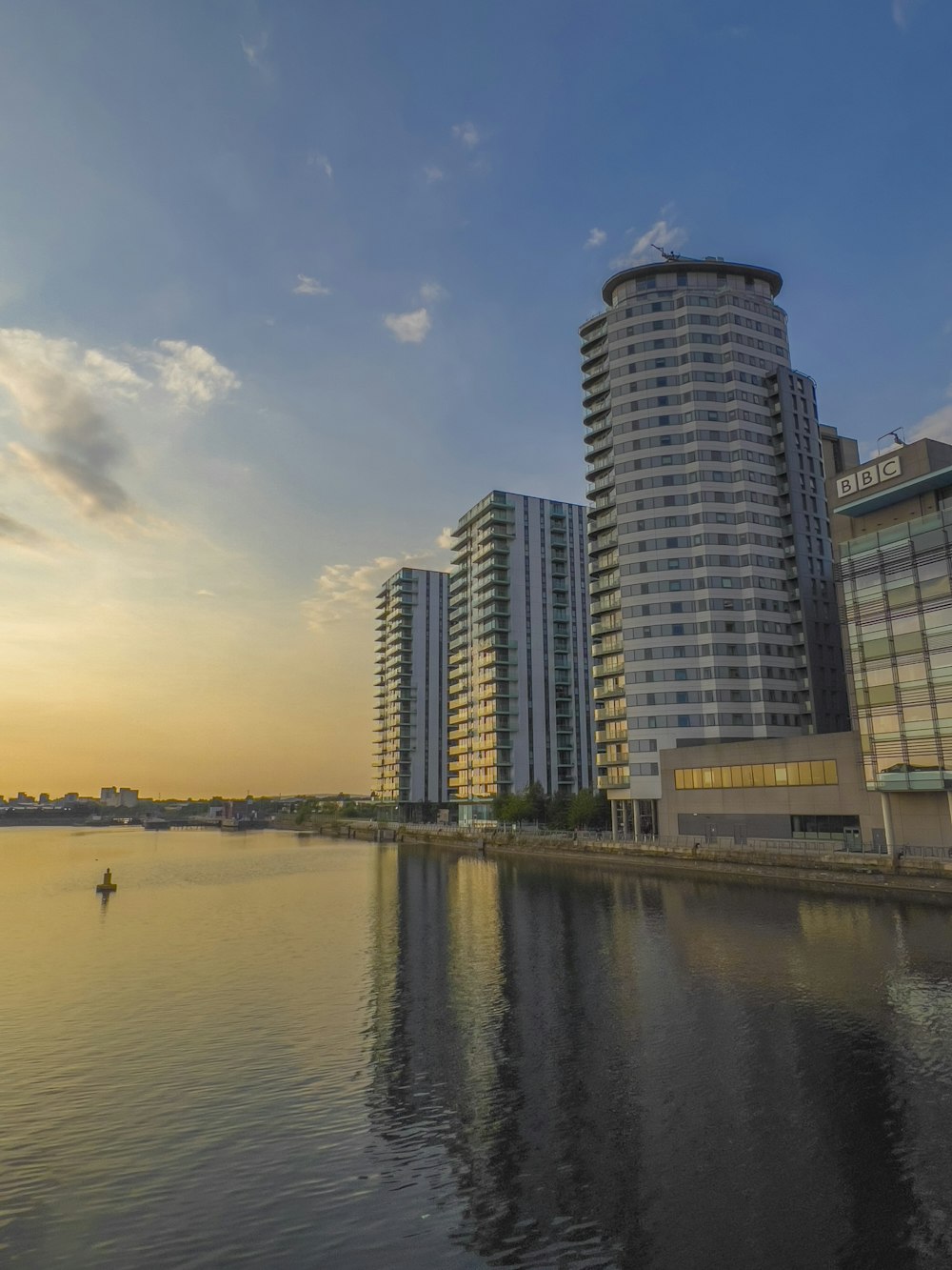 a body of water with buildings along it