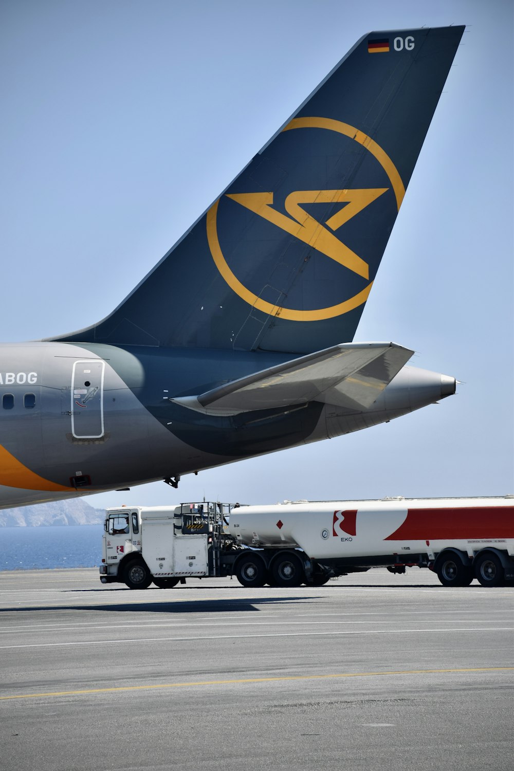 a truck next to an airplane