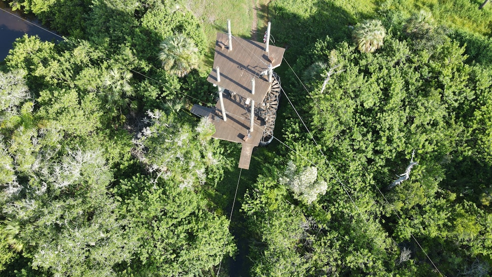 a wooden structure surrounded by trees