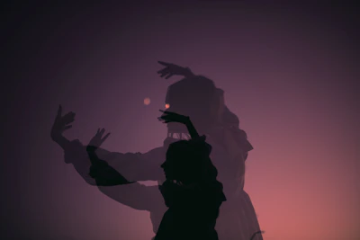Symbolic silhouette of a woman enveloped in layers of translucent violet and black textures.