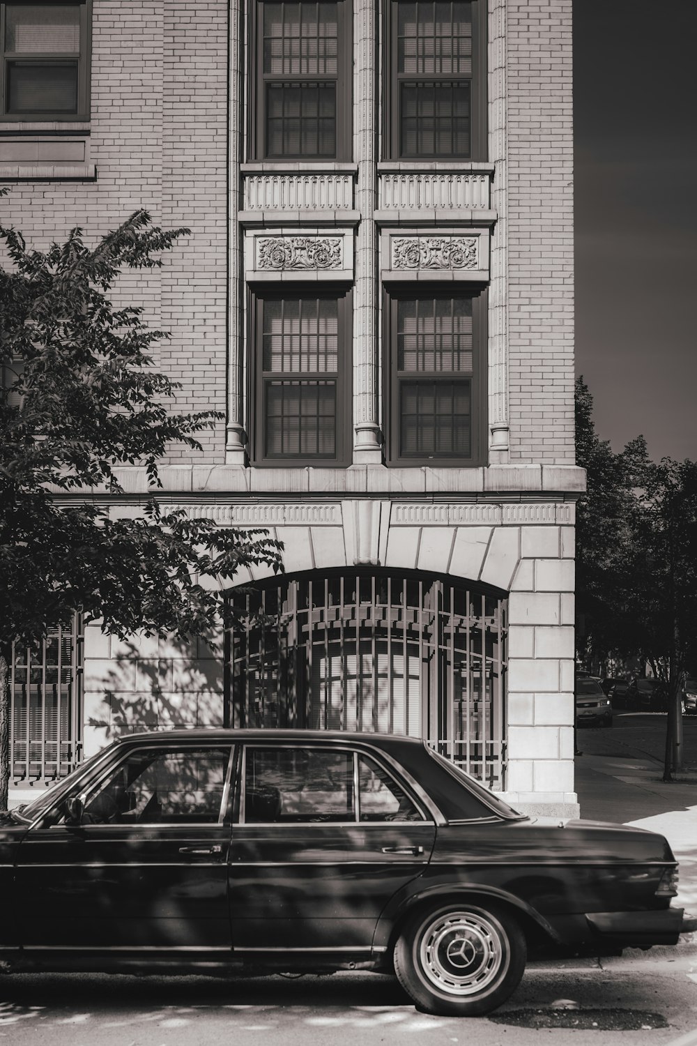 a black car parked in front of a building