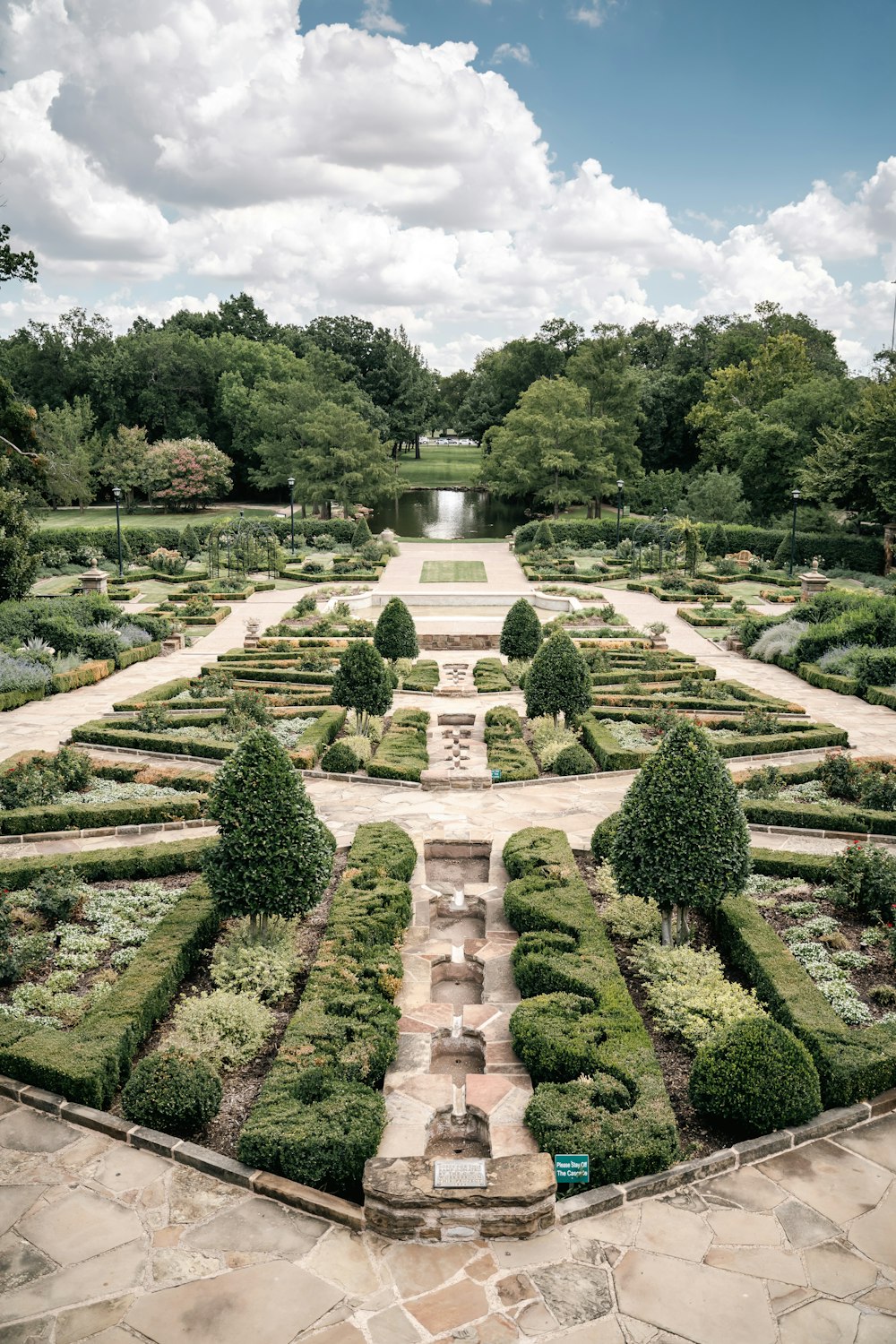 a large garden with a fountain