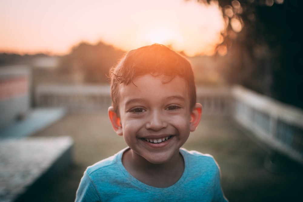 a boy smiling for the camera