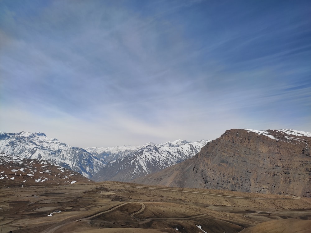 a landscape with mountains in the back