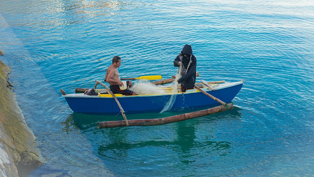 a couple of men in a boat