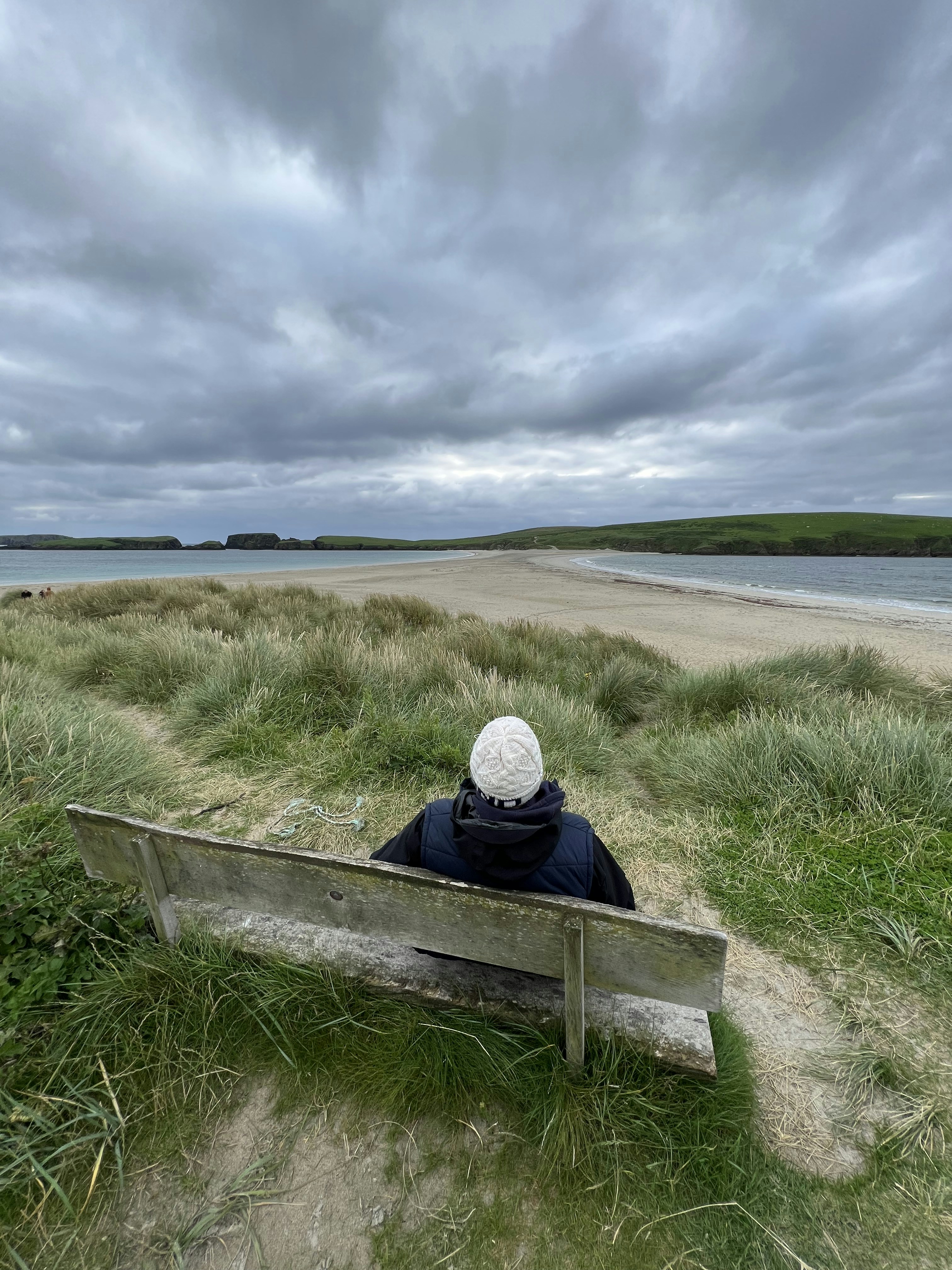 a person sitting on a bench