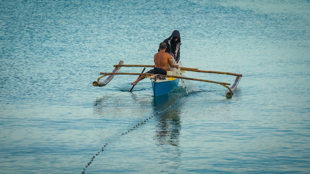 a couple of people in a boat on the water