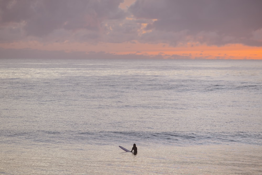 a person surfing in the sea