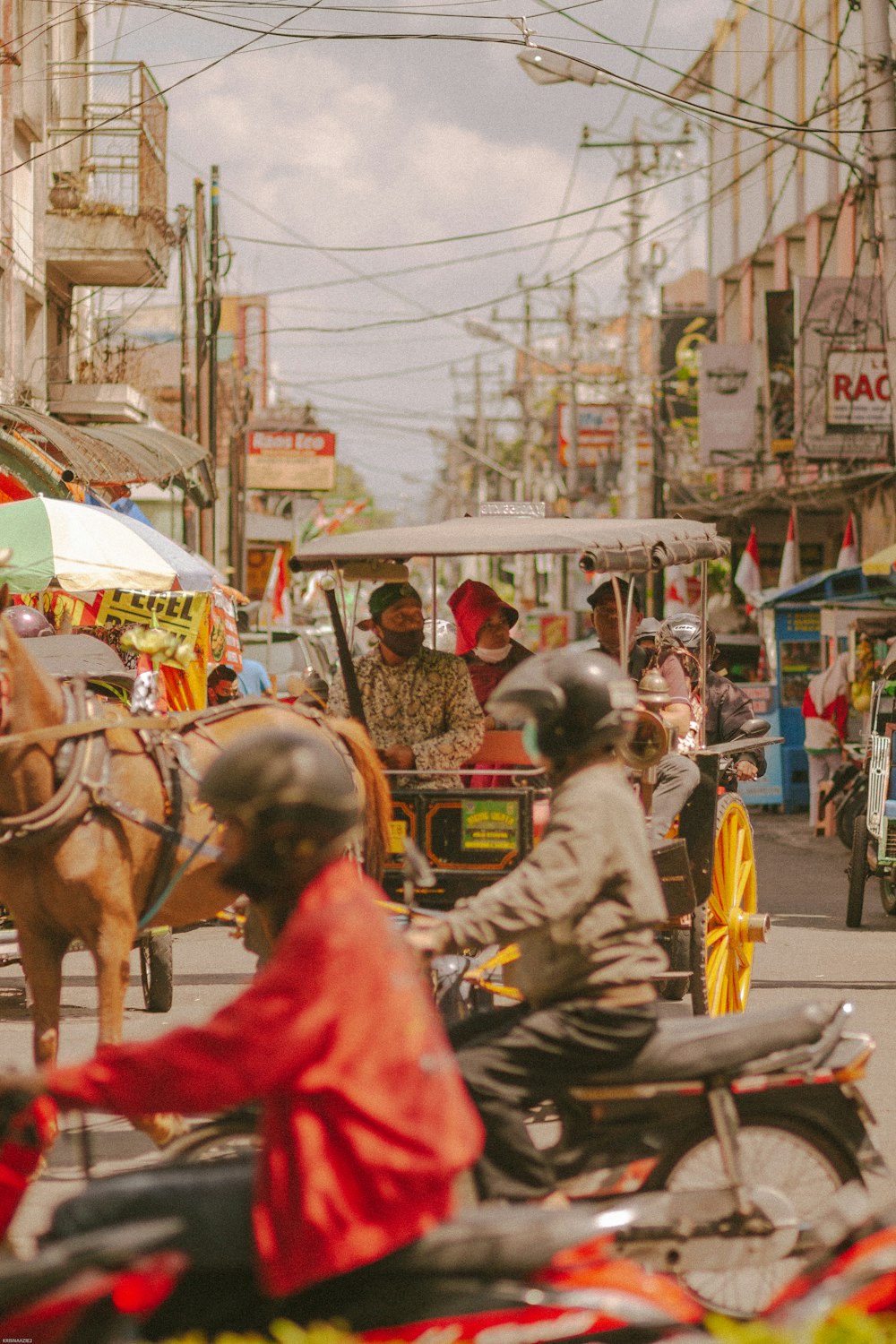 a group of people riding on a motorcycle