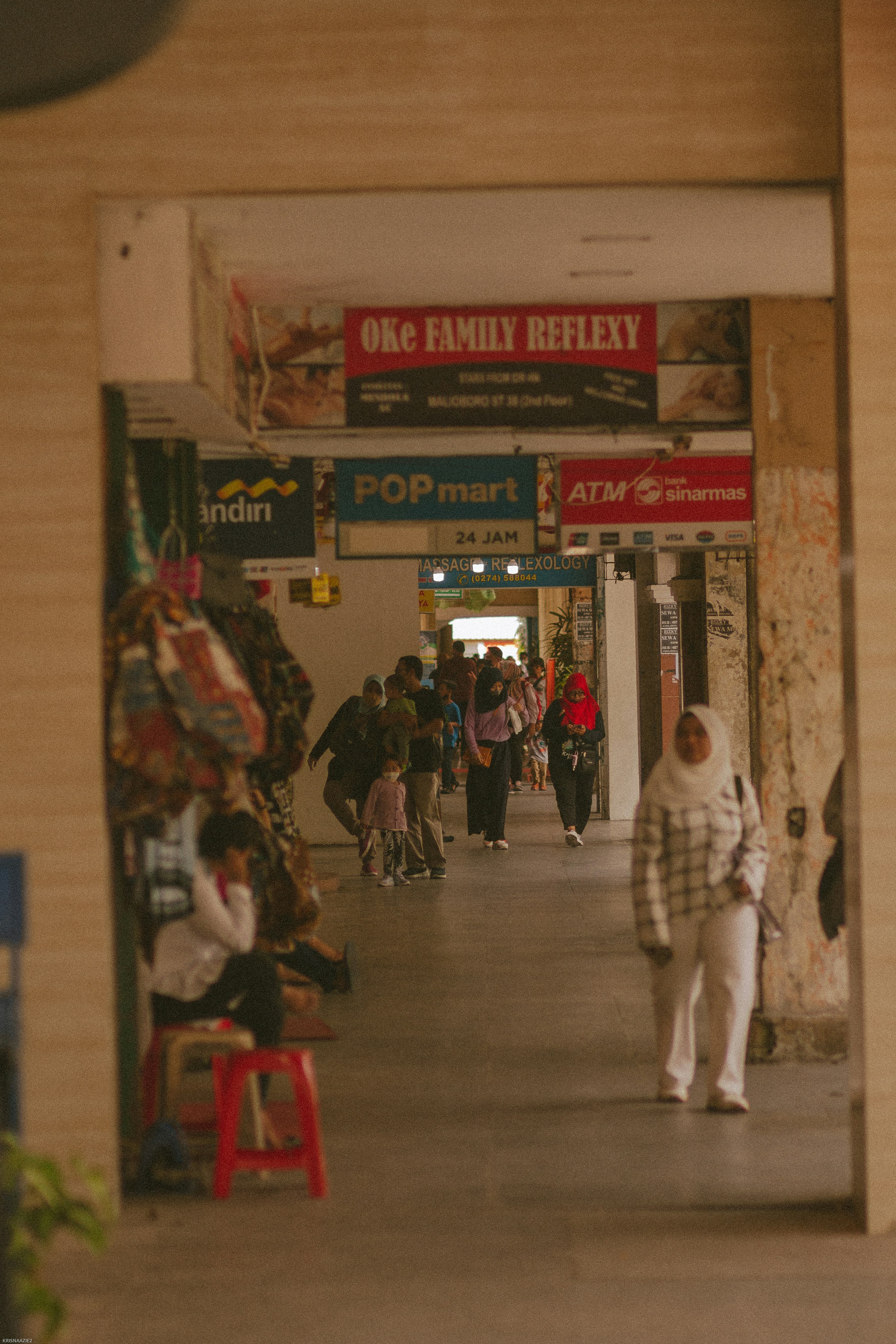 a group of people in a hallway