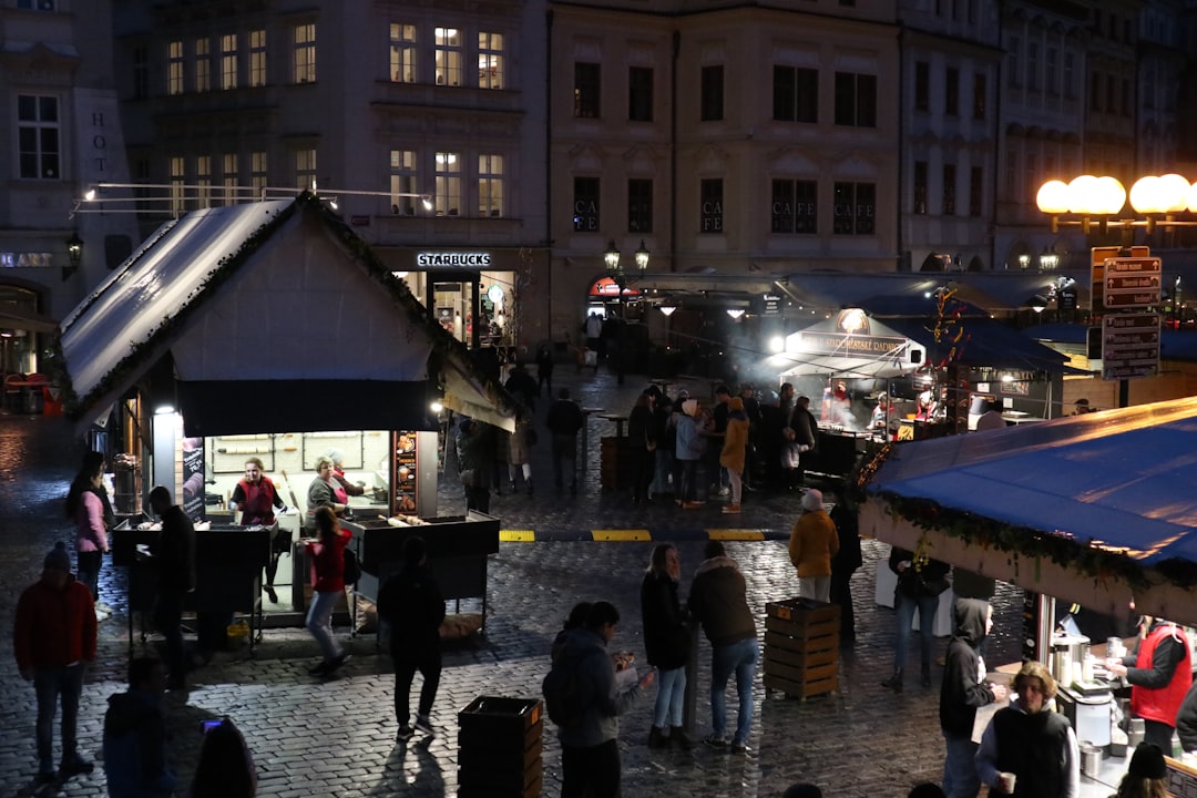a group of people at an outdoor market,