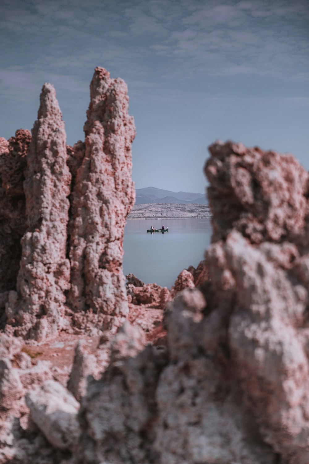 a group of people in a boat on a lake