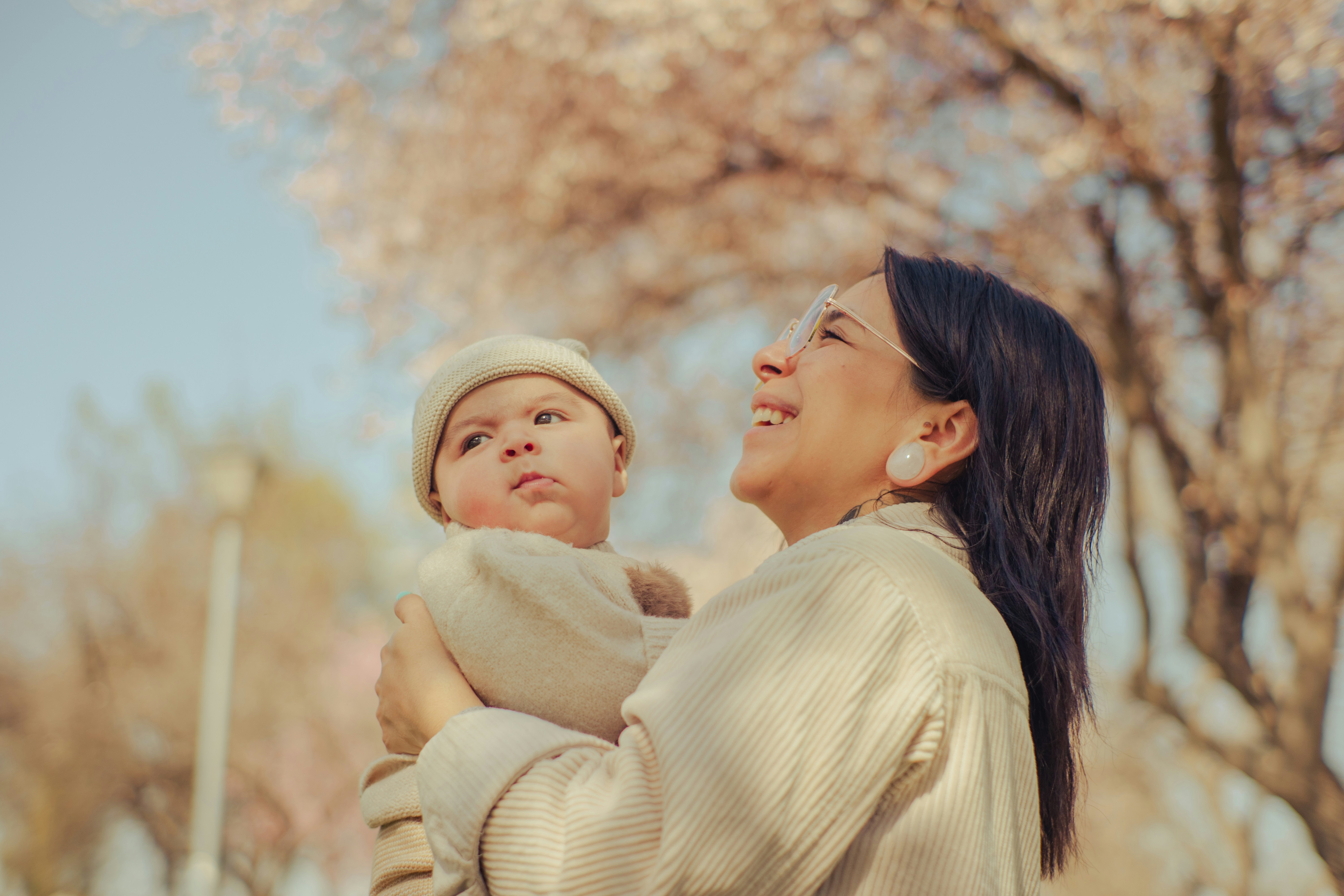 a woman holding a baby