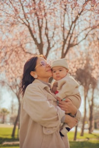 a person holding a baby