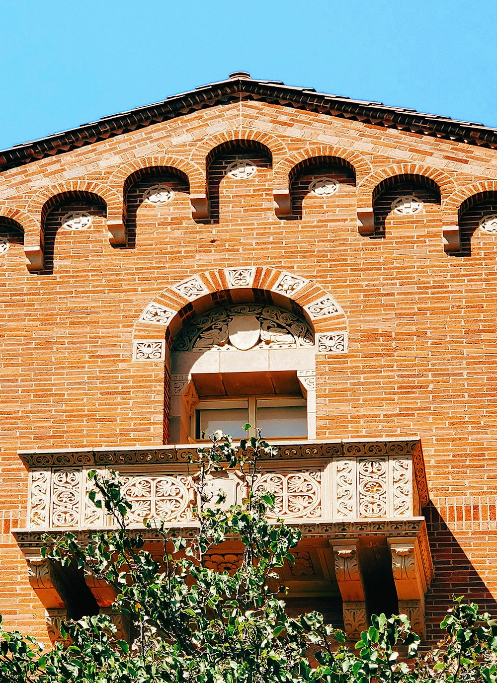 a brick building with a sign on it