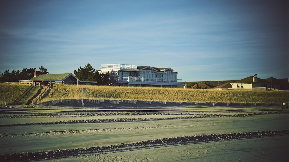 a building with a field in front of it