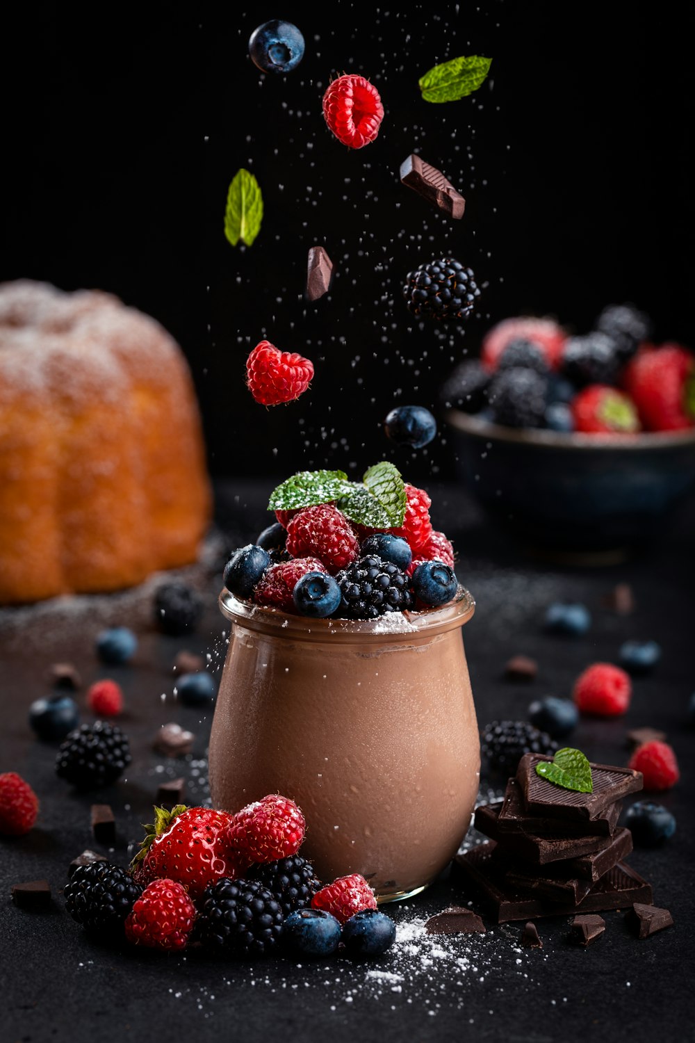 a bowl of berries and a bowl of fruit