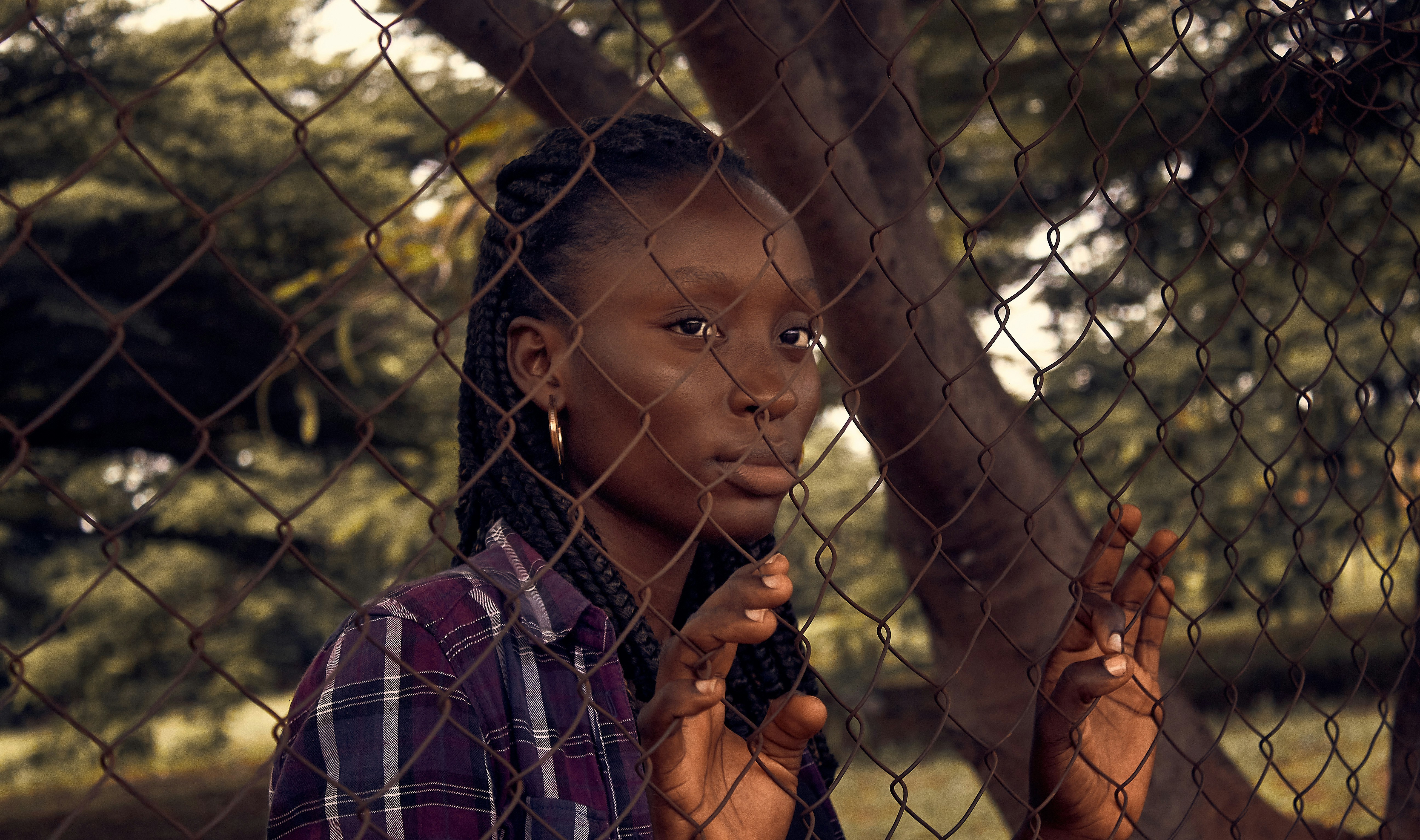 a woman holding a tree branch