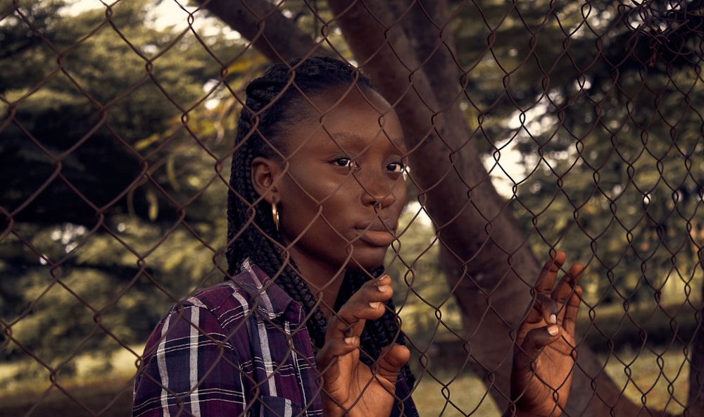 a woman holding a tree branch