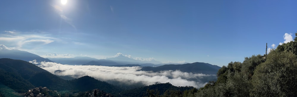 a view of the mountains and clouds