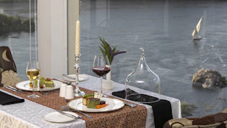 a table with plates and glasses of wine on it