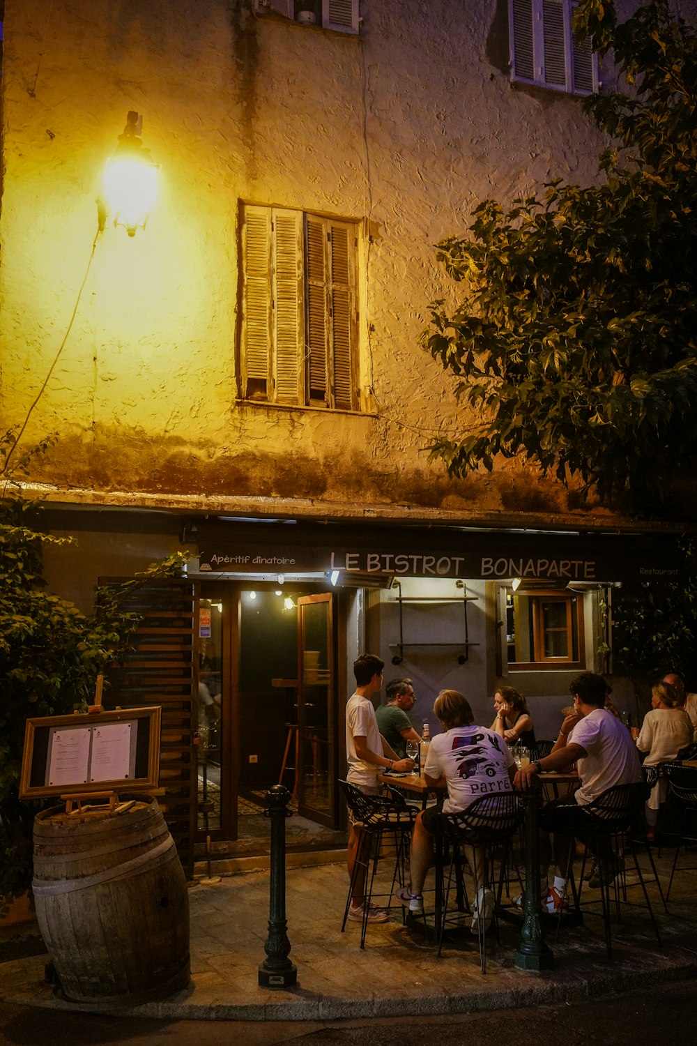 people sitting outside a restaurant