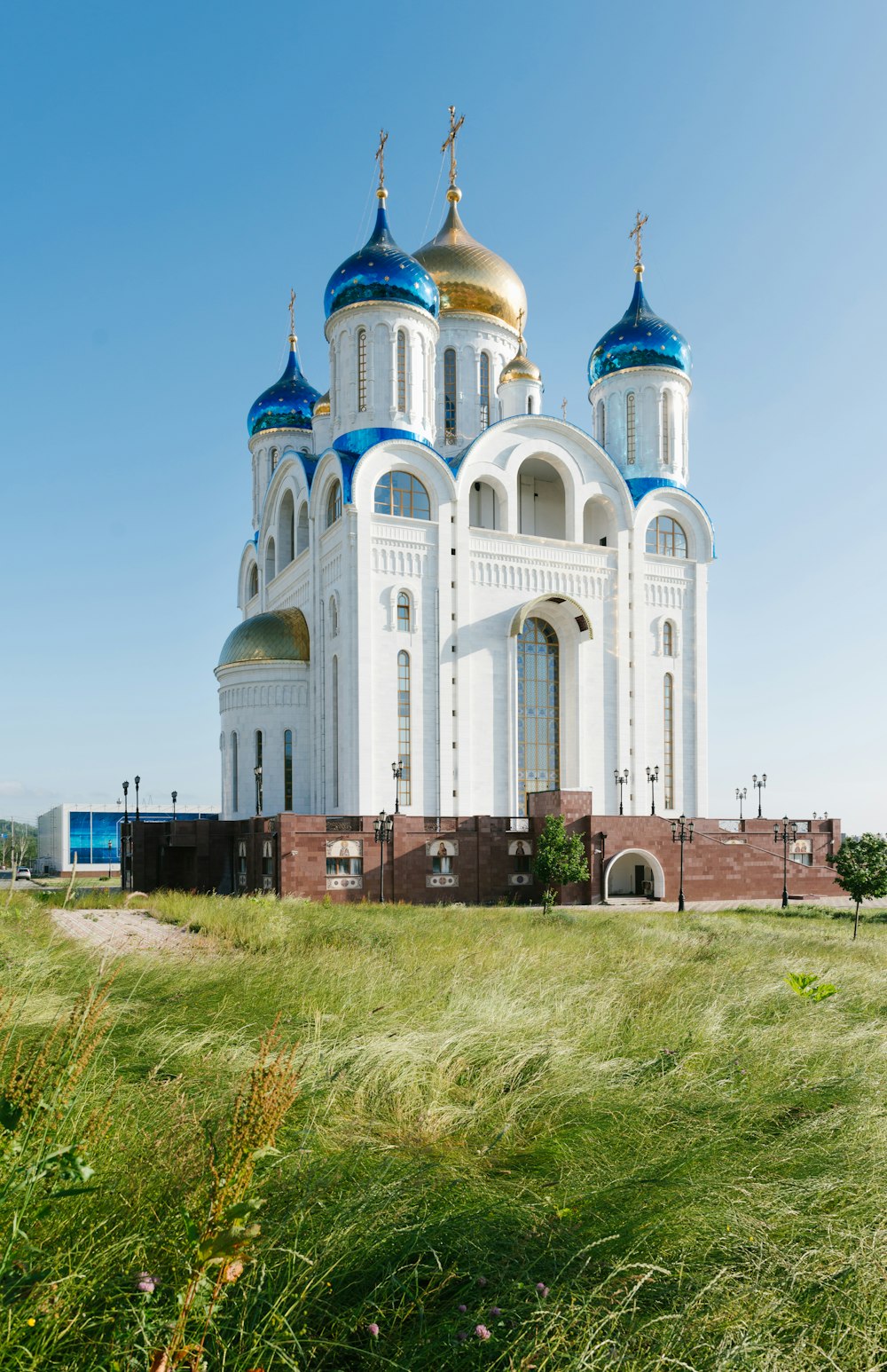 a large white building with blue domes